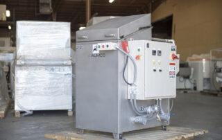 Used rotary cabinet washer awaiting shipment.