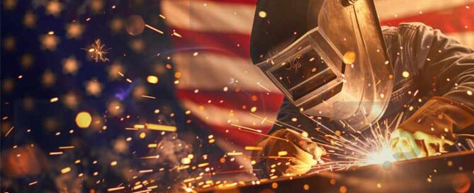 Welder working with sparks flying in front of an American flag, symbolizing strength and precision in U.S. manufacturing.